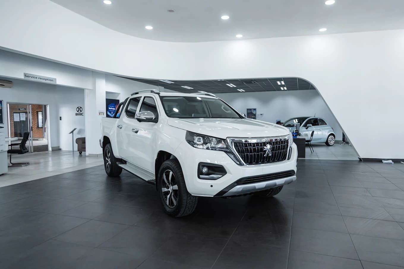 Inside the Stellantis Richards Bay showroom with a Peugeot Landtrek on the floor